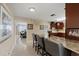 Stylish kitchen featuring a granite countertop breakfast bar and stainless steel appliances at 3309 W Ellicott St, Tampa, FL 33614