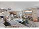 Bright living room showcasing a modern glass coffee table, stylish decor, and convenient bar area with seating at 3309 W Ellicott St, Tampa, FL 33614
