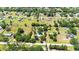 An aerial view showcases this property's lot size and mature landscaping in the surrounding community at 3319 Fox Ridge Blvd, Wesley Chapel, FL 33543
