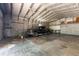 Interior view of garage holding work vehicle with multiple tools and fan for ventilation at 3319 Fox Ridge Blvd, Wesley Chapel, FL 33543