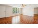 Bright living room features hardwood floors and large windows at 3319 Fox Ridge Blvd, Wesley Chapel, FL 33543