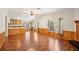 Open living area with breakfast bar, hardwood floors, wainscoting and natural light at 3319 Fox Ridge Blvd, Wesley Chapel, FL 33543