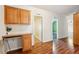 Office area with wood cabinetry and a built-in desk, with two doorways leading to other rooms at 3319 Fox Ridge Blvd, Wesley Chapel, FL 33543