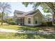Exterior view of home with well-maintained landscaping at 3583 Wembley Way # 101, Palm Harbor, FL 34685