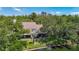 Scenic aerial view of a home featuring a screened patio with lake views at 3611 Pine Knot Dr, Valrico, FL 33596