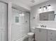 Bathroom featuring a glass enclosed shower, updated vanity, and modern light fixture at 3611 Pine Knot Dr, Valrico, FL 33596