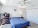 This bedroom has carpet flooring, ceiling fan and closet for storing clothes at 3611 Pine Knot Dr, Valrico, FL 33596