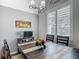 Dining room featuring hardwood floors, vaulted ceilings, modern lighting and large windows at 3611 Pine Knot Dr, Valrico, FL 33596