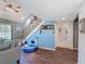 Bright entryway with hardwood floors, a staircase, and a view of the water at 3611 Pine Knot Dr, Valrico, FL 33596