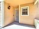 Inviting front porch with a secure screen door and a classic wall-mounted lantern at 3611 Pine Knot Dr, Valrico, FL 33596