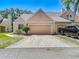 Charming single-Gathering home with a well-manicured lawn and a single-car garage in a desirable neighborhood at 3611 Pine Knot Dr, Valrico, FL 33596