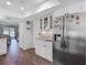 Updated kitchen with granite countertops, stainless refrigerator and open floorplan at 3611 Pine Knot Dr, Valrico, FL 33596