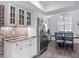 View of kitchen with granite countertops, stainless refrigerator, hardwood floors and casual eating area at 3611 Pine Knot Dr, Valrico, FL 33596