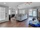Open living room with hardwood floors, water views, fireplace, and sliding doors at 3611 Pine Knot Dr, Valrico, FL 33596