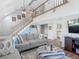 Spacious living room with stairway to the second floor, comfortable seating, and an open floor plan at 3611 Pine Knot Dr, Valrico, FL 33596