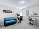 Bright office space featuring a couch, multiple desks, and ample natural light at 3611 Pine Knot Dr, Valrico, FL 33596