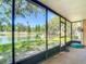 Enclosed porch with great view of the lake, fountain, and landscaped grounds at 3611 Pine Knot Dr, Valrico, FL 33596