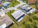 An aerial view of the home's exterior, landscaping, fenced yard, and community at 4256 Rudder Way, New Port Richey, FL 34652