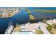 Stunning aerial view of waterfront homes, docks, lush greenery, and serene water views at 4256 Rudder Way, New Port Richey, FL 34652