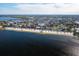 Stunning aerial view showcasing the coastline, homes, and community amenities along the waterfront at 4256 Rudder Way, New Port Richey, FL 34652