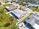 This aerial view highlights the property's landscaping, patio, and white privacy fence at 4256 Rudder Way, New Port Richey, FL 34652