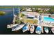 Picturesque aerial view of a yacht club with a pool, marina, and lush landscaping by the water at 4256 Rudder Way, New Port Richey, FL 34652