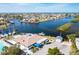 Breathtaking aerial view of a community featuring waterfront homes, boat docks, and expansive water views at 4256 Rudder Way, New Port Richey, FL 34652