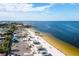 Aerial view of the community beach, with beachside parking and plenty of room for activities at 4256 Rudder Way, New Port Richey, FL 34652