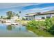 Back of the house showing dock with waterfront views, perfect for enjoying peaceful waterfront living at 4256 Rudder Way, New Port Richey, FL 34652