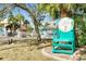 A beach club entrance with manicured lawns, palm trees, and access to a private beach at 4256 Rudder Way, New Port Richey, FL 34652
