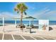 Charming beach with covered picnic areas, tables, and grilling stations, enhancing the coastal experience at 4256 Rudder Way, New Port Richey, FL 34652
