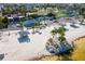 Aerial view of the community beach featuring covered picnic spots and ample parking at 4256 Rudder Way, New Port Richey, FL 34652