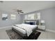 Serene bedroom boasts natural light, ceiling fan, and cozy ambiance for comfortable living at 4256 Rudder Way, New Port Richey, FL 34652