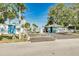 View of community beach entrance with gatehouse, parking, and easy beach access at 4256 Rudder Way, New Port Richey, FL 34652