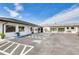 Well-maintained commercial building with ample parking, manicured landscaping, and modern architecture at 4256 Rudder Way, New Port Richey, FL 34652