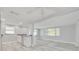 Bright kitchenette with white cabinets, modern appliances, and a breakfast bar at 4256 Rudder Way, New Port Richey, FL 34652