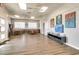 Spacious community living area featuring tables, chairs, bookshelves, and stylish decorative artwork at 4256 Rudder Way, New Port Richey, FL 34652