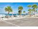 Parking area near a beach with shaded picnic tables, showcasing convenience and nearby amenities at 4256 Rudder Way, New Port Richey, FL 34652