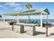 Beach picnic area featuring grilling stations and covered tables with stunning waterfront views at 4256 Rudder Way, New Port Richey, FL 34652