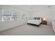Bright bedroom with large windows, neutral carpet, and simple furniture creates a clean and open feel at 442 22Nd Se Ave, St Petersburg, FL 33705