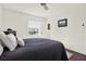 Comfortable bedroom with natural light, crisp white walls, and dark wood floors, creating a serene retreat at 5007 Starfish Se Dr # A, St Petersburg, FL 33705