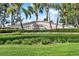 Community entrance sign, 'Waterside', surrounded by lush landscaping and palm trees at 5007 Starfish Se Dr # A, St Petersburg, FL 33705