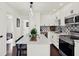 Well-appointed kitchen with white cabinets, modern appliances, and a convenient center island at 5007 Starfish Se Dr # A, St Petersburg, FL 33705
