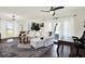 Bright and airy living room with hardwood floors, waterfront views, and stylish furniture at 5007 Starfish Se Dr # A, St Petersburg, FL 33705