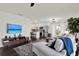 Bright open-concept living room and kitchen featuring modern decor and hardwood floors at 5007 Starfish Se Dr # A, St Petersburg, FL 33705
