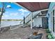 Relaxing outdoor patio with stylish seating, waterfront views, and convenient access to the upper level at 5007 Starfish Se Dr # A, St Petersburg, FL 33705