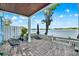 Inviting outdoor patio featuring brick pavers, comfortable seating, and panoramic waterfront views at 5007 Starfish Se Dr # A, St Petersburg, FL 33705