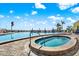 Community swimming pool and spa overlooking the beach, perfect for relaxation and enjoying ocean views at 5007 Starfish Se Dr # A, St Petersburg, FL 33705