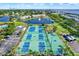 Aerial shot of tennis courts, pickleball courts, and basketball courts in the community at 5007 Starfish Se Dr # A, St Petersburg, FL 33705