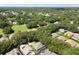 Expansive aerial view of the community showcasing lush greenery, well-spaced homes and community golf course at 5416 Twin Creeks Dr, Valrico, FL 33596